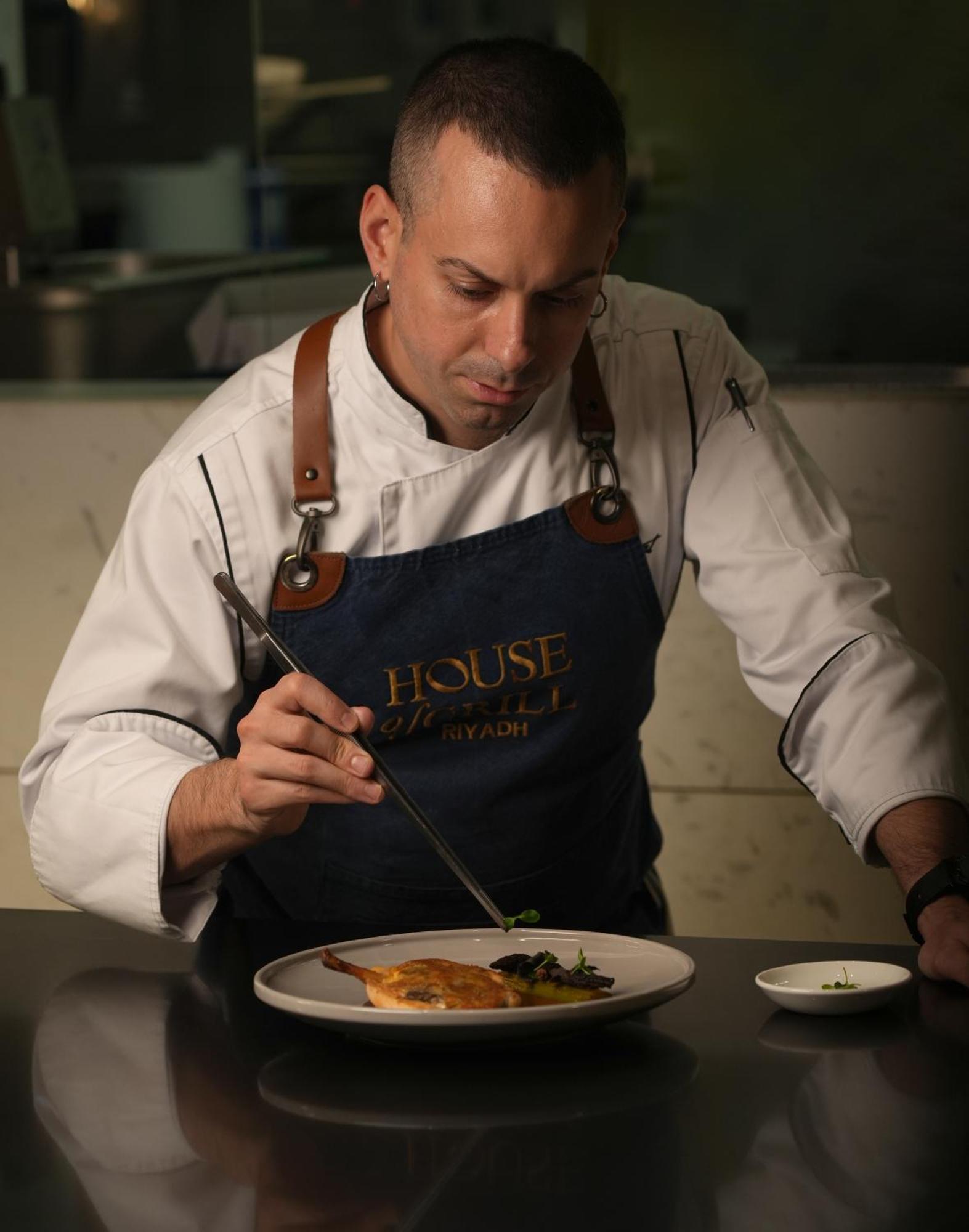 Fairmont Riyadh Exterior photo A chef preparing a meal